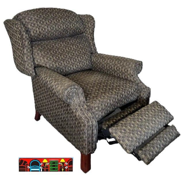 'A gently used push-back wing-back recliner featuring rolled arms, exposed wooden legs, and nail head accents, upholstered in a fabric of various shades of grey.' (Reclined)