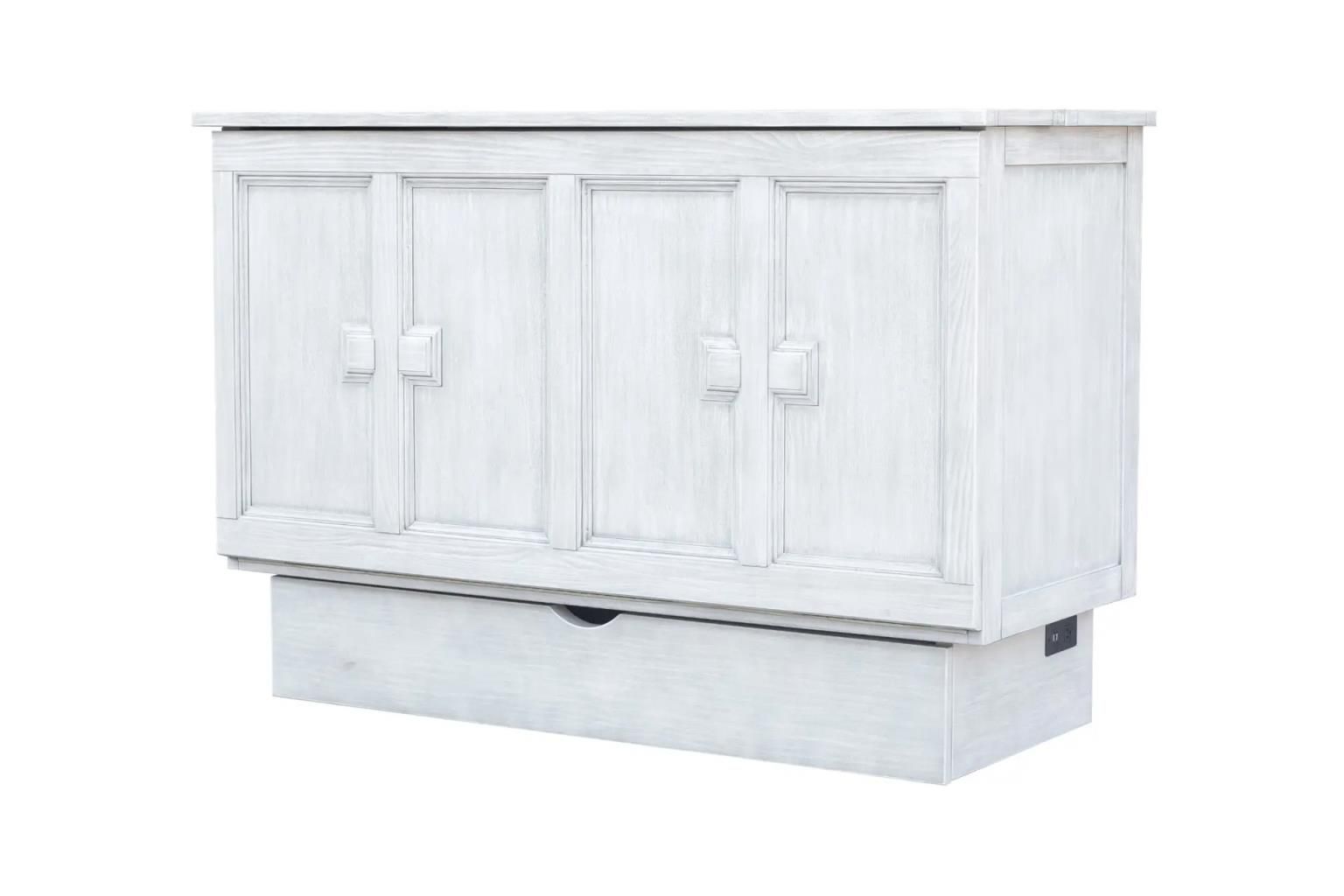Weathered white wood cabinet bed with large square wooden decorative handles. Large drawer at the bottom. Angled view.