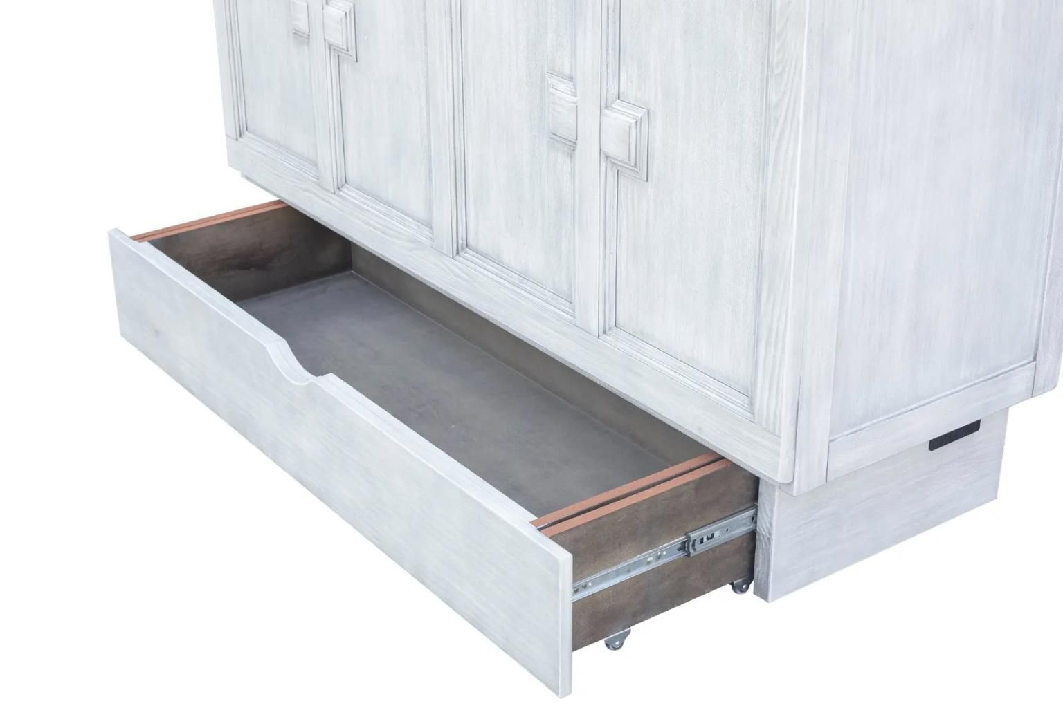 Weathered white wood cabinet bed with large square wooden decorative handles. Large drawer at the bottom. Angled view with bottom drawer open.