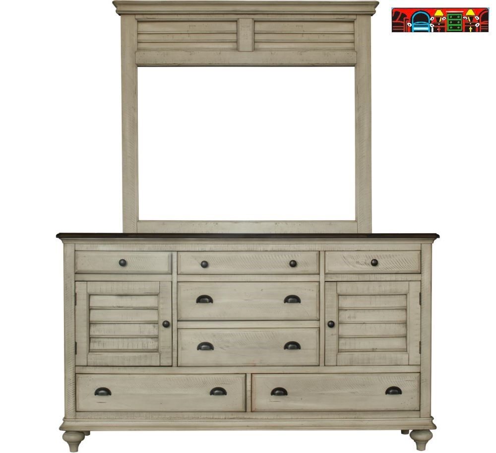 The Brockton Dresser and mirror feature solid wood construction, a wheat color finish with a dark brown top, and a distressed look. They include louver accents, seven drawers, two doors, and contrasting metal handles.