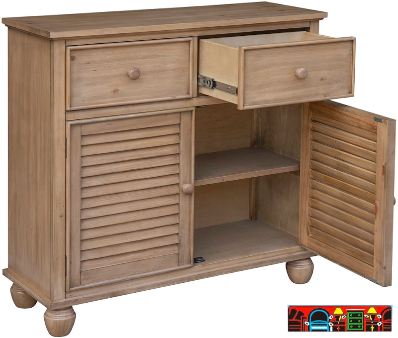 The Nantucket Cabinet, crafted from wood and finished in river wash natural. Features Two drawers, two doors, and a shelf. It is available at Bratz-CFW in Fort Myers, FL.