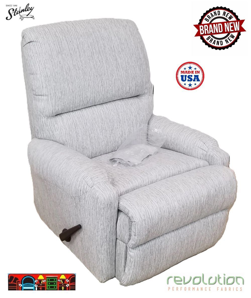 'Three-way recliner featuring a pad-over chaise design, complete with arm covers. Upholstered in white and grey performance fabric. Proudly made in the USA!'