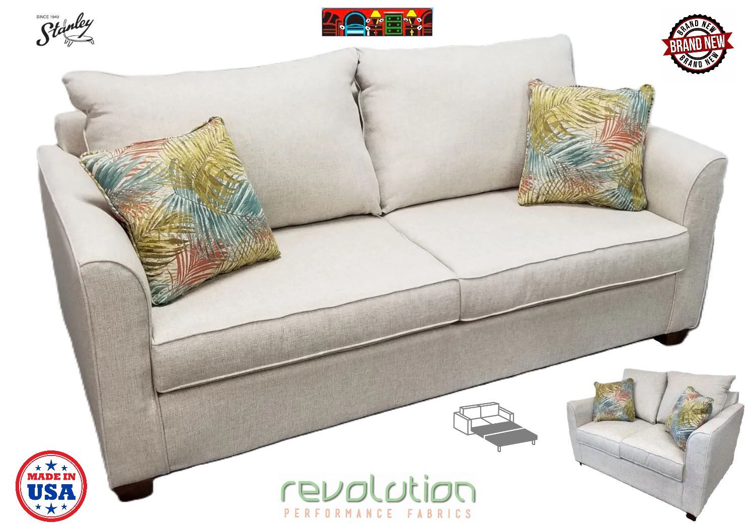This sofa features a performance fabric in oatmeal color, designed with elegant tuxedo arms, sleek flat sides, and sturdy natural wood legs. The back cushions are attached, while the seat cushions are reversible for convenience. It comes with two tropical-themed throw pillows, boasting a vibrant pattern of blues, reds, and a golden leaf design. Proudly crafted in the USA!