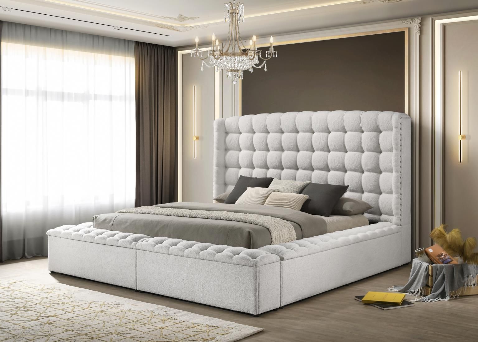 White completely upholstered storage bed with high headboard, tufted surround and nail head accents.