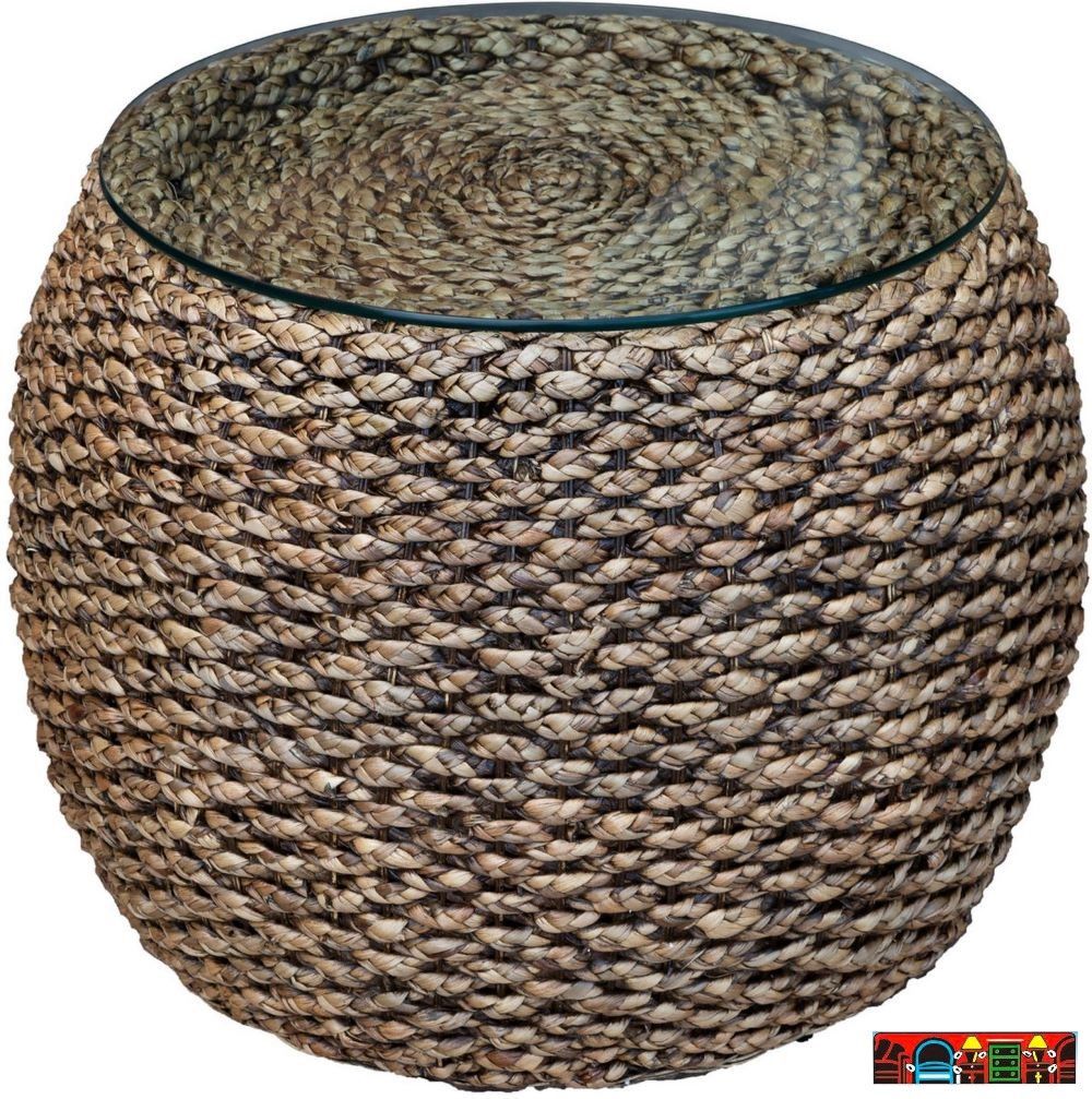 The Ocean Reef round end table, featuring woven seagrass in a natural color and a glass top, is available at Bratz-CFW in Fort Myers, FL.