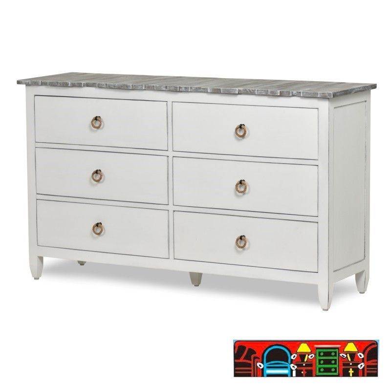 The Picket Fence Bedroom Dresser offers a coastal charm with its solid wood construction, distressed white finish, weathered grey top, and rope pulls. Available at Bratz-CFW.