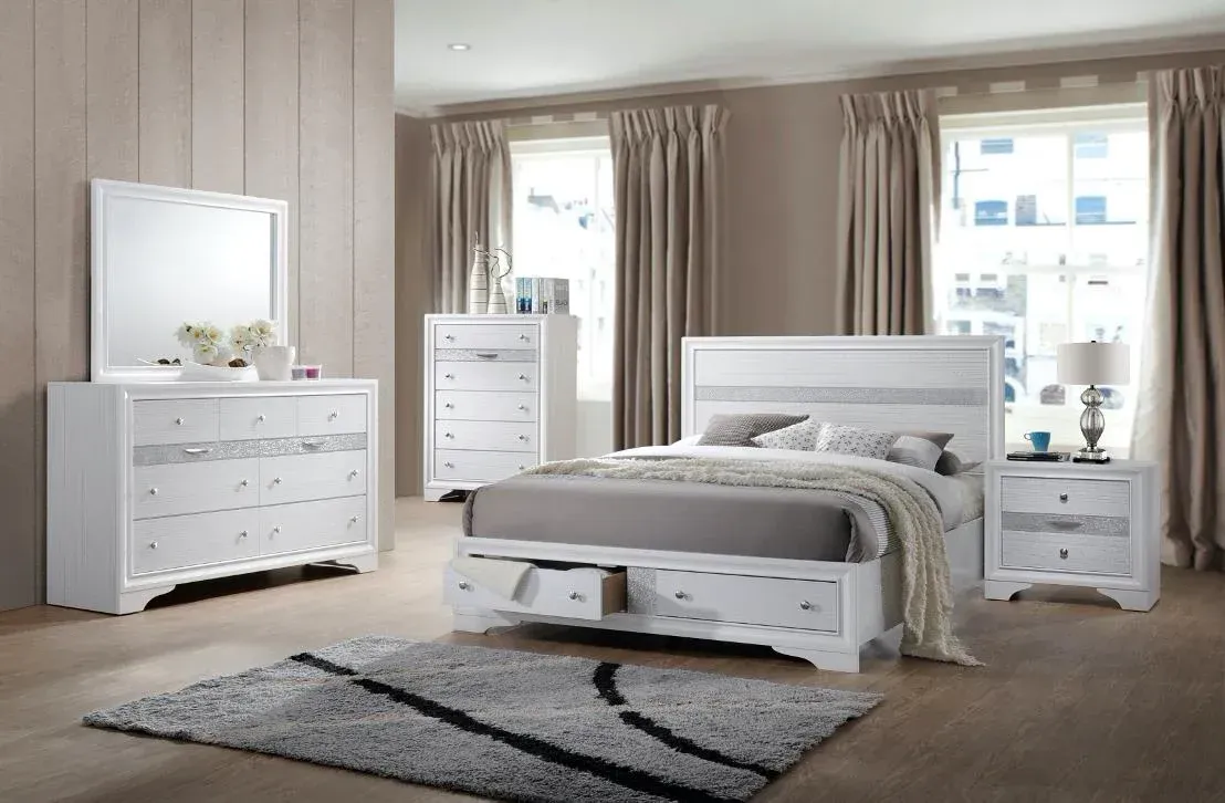 A modern white bedroom set with silver accent jewelry drawers and storage bed with 2 drawers in the footboard.
