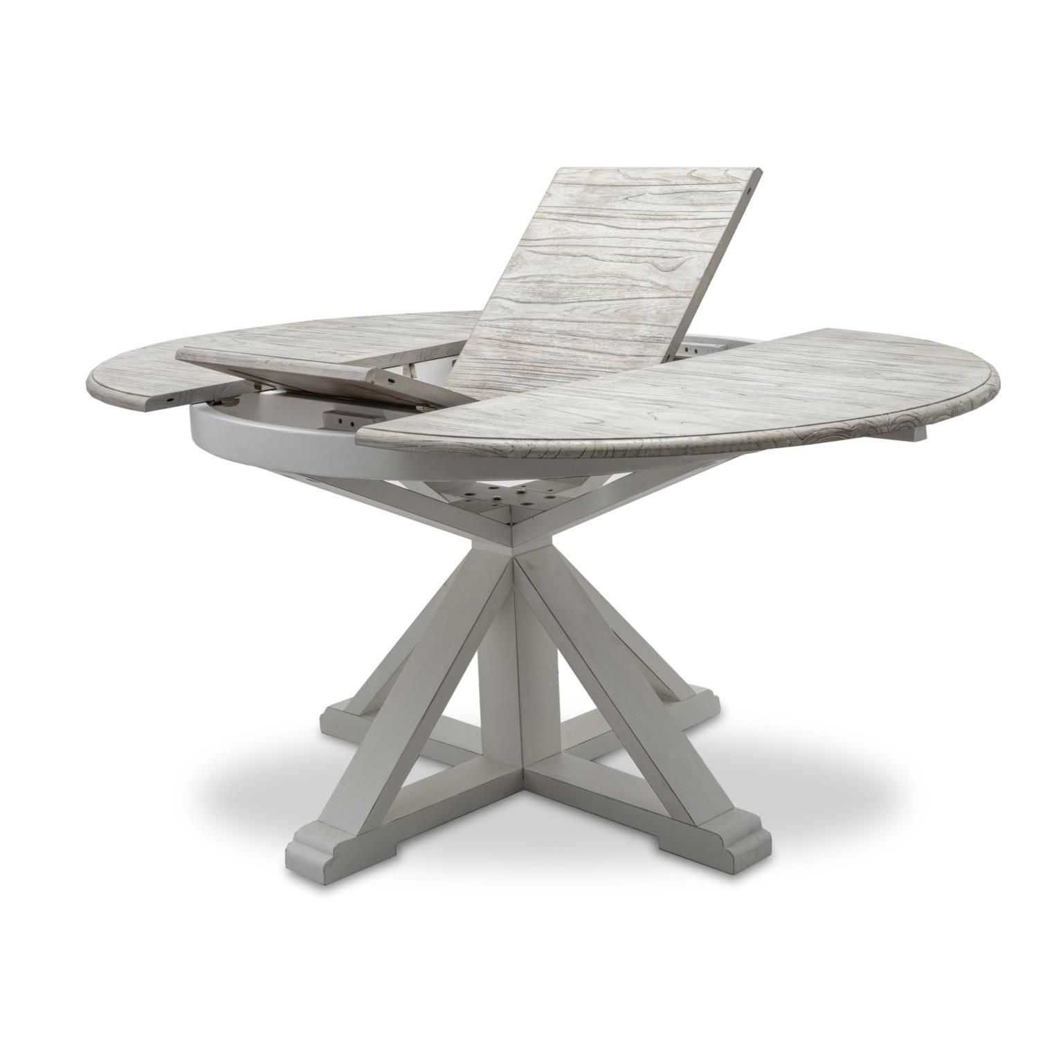 Islamorada white pedestal table featuring a butterfly leaf and a distressed grey finish on the top.
