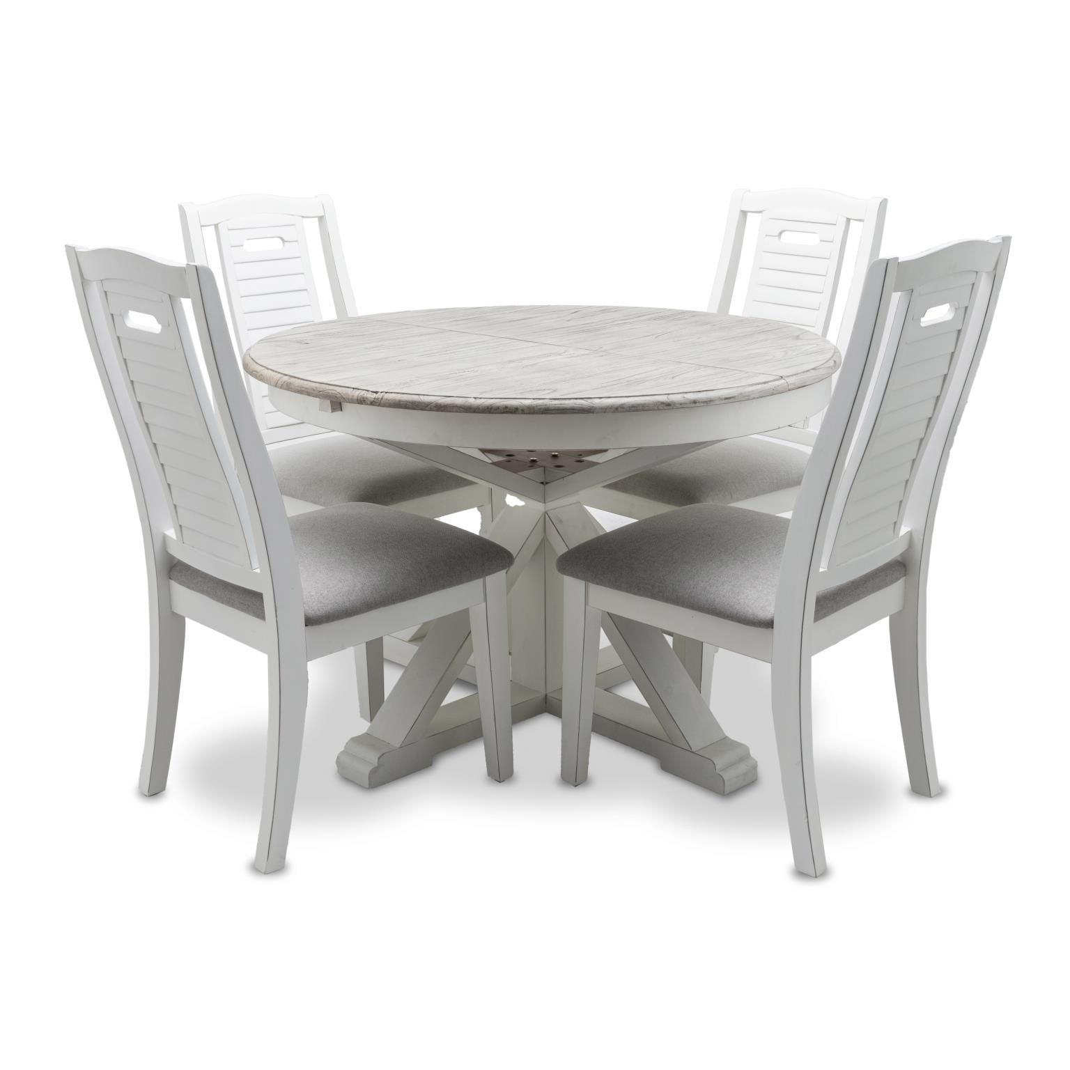 The Islamorada 5-piece dining set features a wooden construction with a white frame and a distressed grey top. It includes a butterfly leaf and four side chairs with shutter backs.