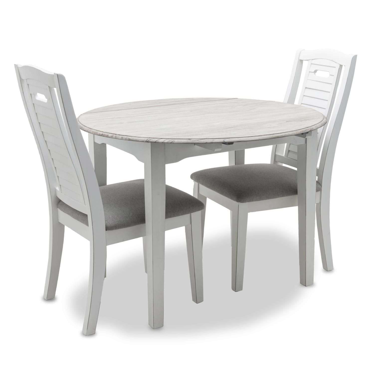 Islamorada 'Three-piece dinette set in white and distressed grey, featuring a drop-leaf table and two side chairs with shutter backs and grey cushions.'
