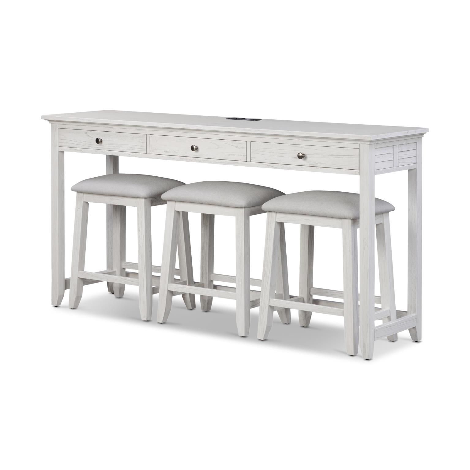 Weathered white wood 3-drawer console table with power supply and round iron handles. With 3 small stools with light grey upholstered seat cushions.