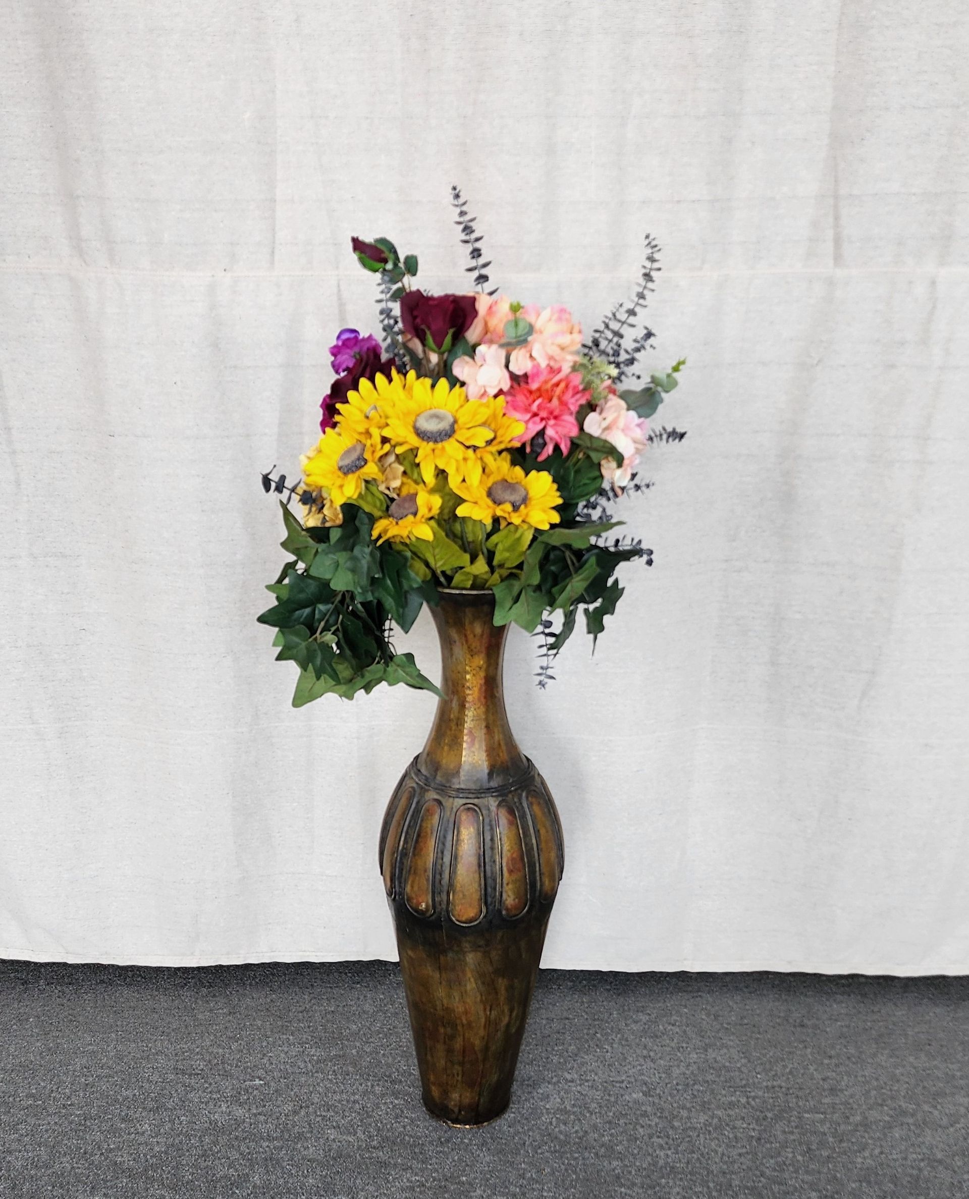 Flower arrangement in bronze color vase