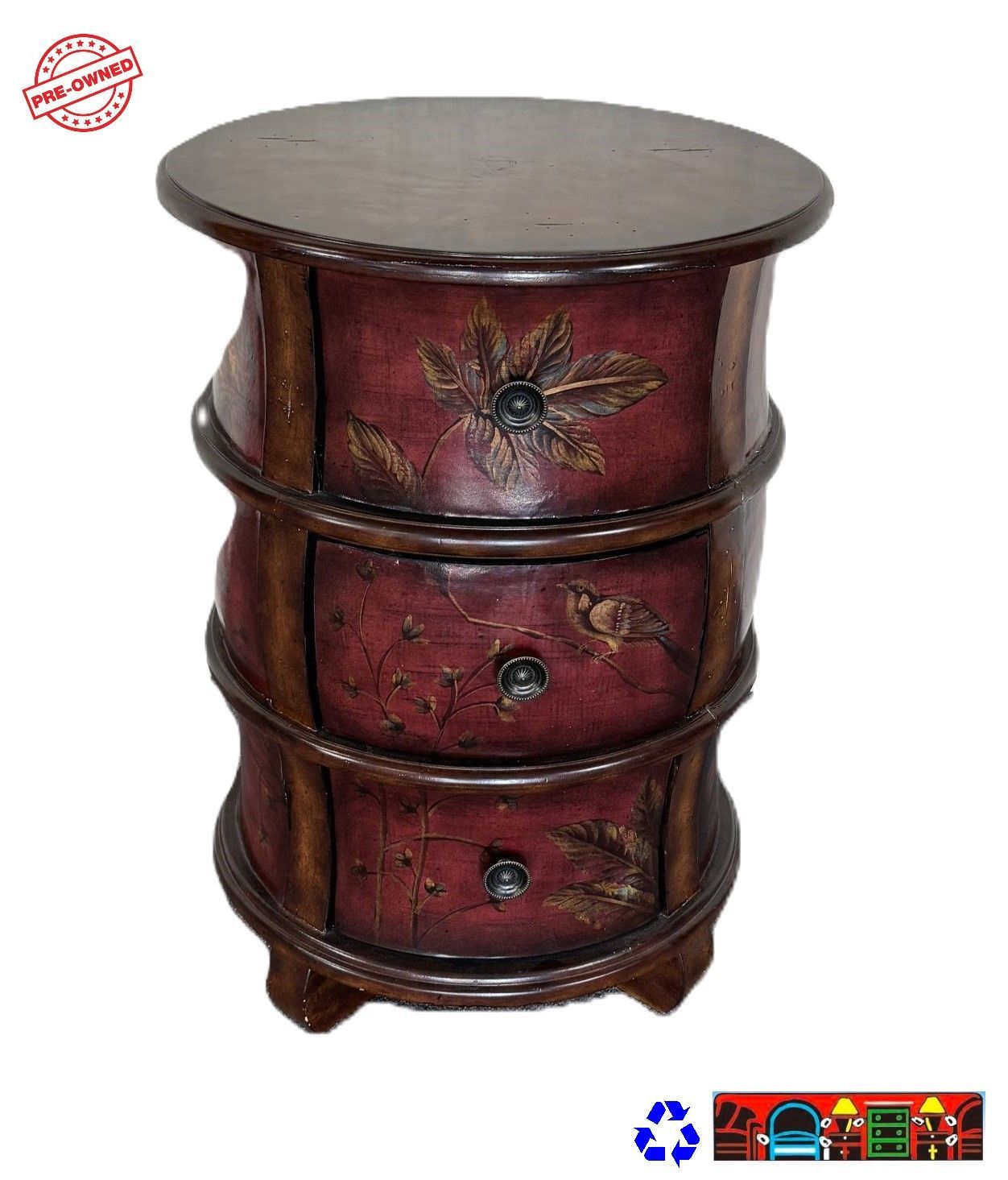 A round accent chest, featuring brown and red drawers with hand-painted leaves on the front, is available at Bratz-CFW in Fort Myers, FL.