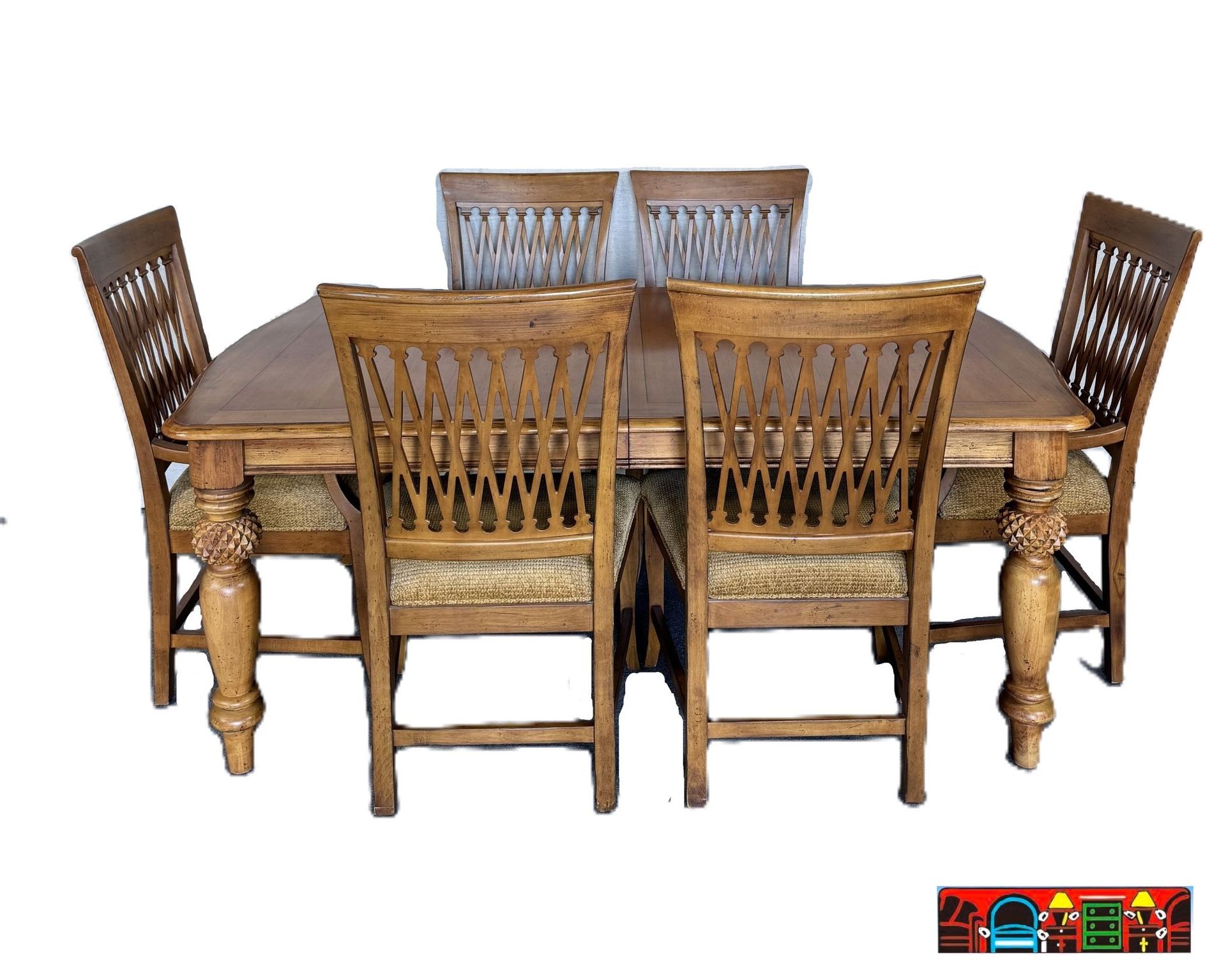 Tommy Bahama dining set for sale: used, solid wood in medium brown, rectangular table with pineapple leg details, and six chairs, available at Bratz-CFW.