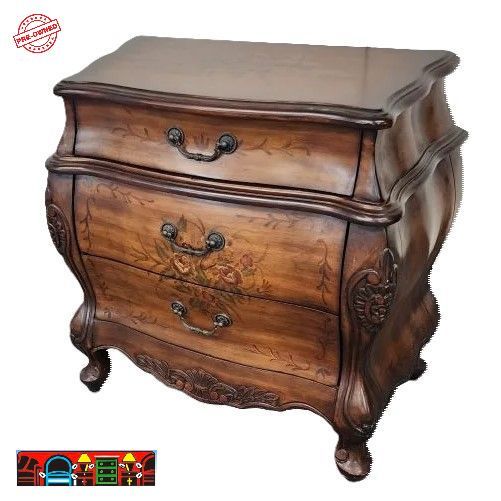 A Bombay chest with three drawers, crafted from wood in a brown finish and adorned with hand-painted accents, is available at Bratz-CFW in Fort Myers, FL.
