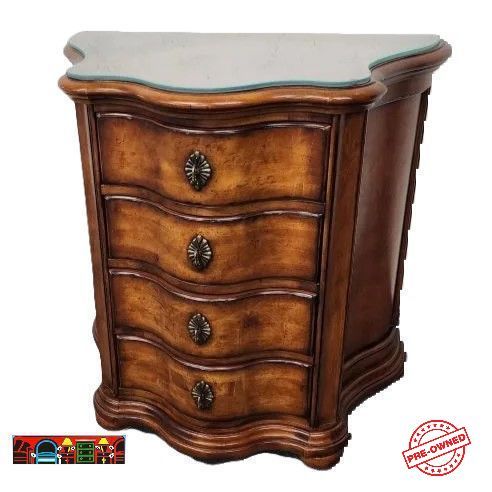 The Century four-drawer nightstand, featuring a mahogany finish, iron handles, and a half-moon shape, is available at Bratz-CFW in Fort Myers, FL.
