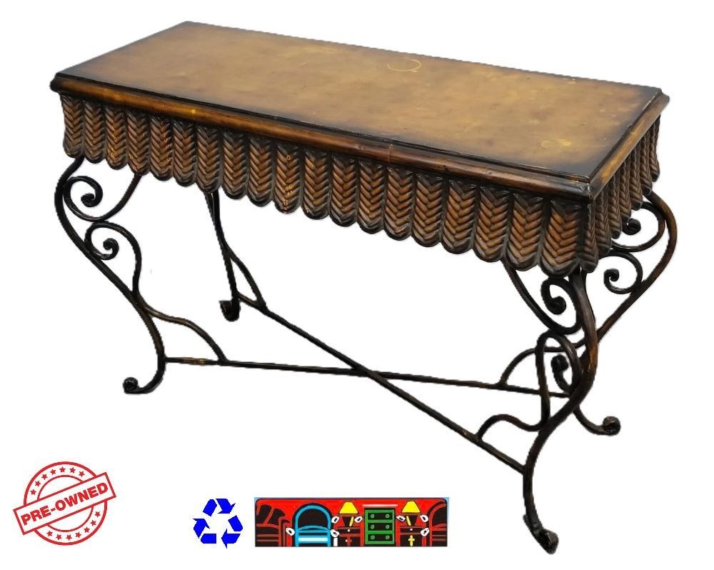 'A pre-owned Sofa Table: This elegant piece features a decorative metal base, complemented by a copper top and ornate apron.'