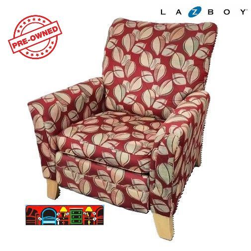 'A gently used High-back recliner in red with a tropical leaf pattern and natural legs, featuring a push-back mechanism.'

