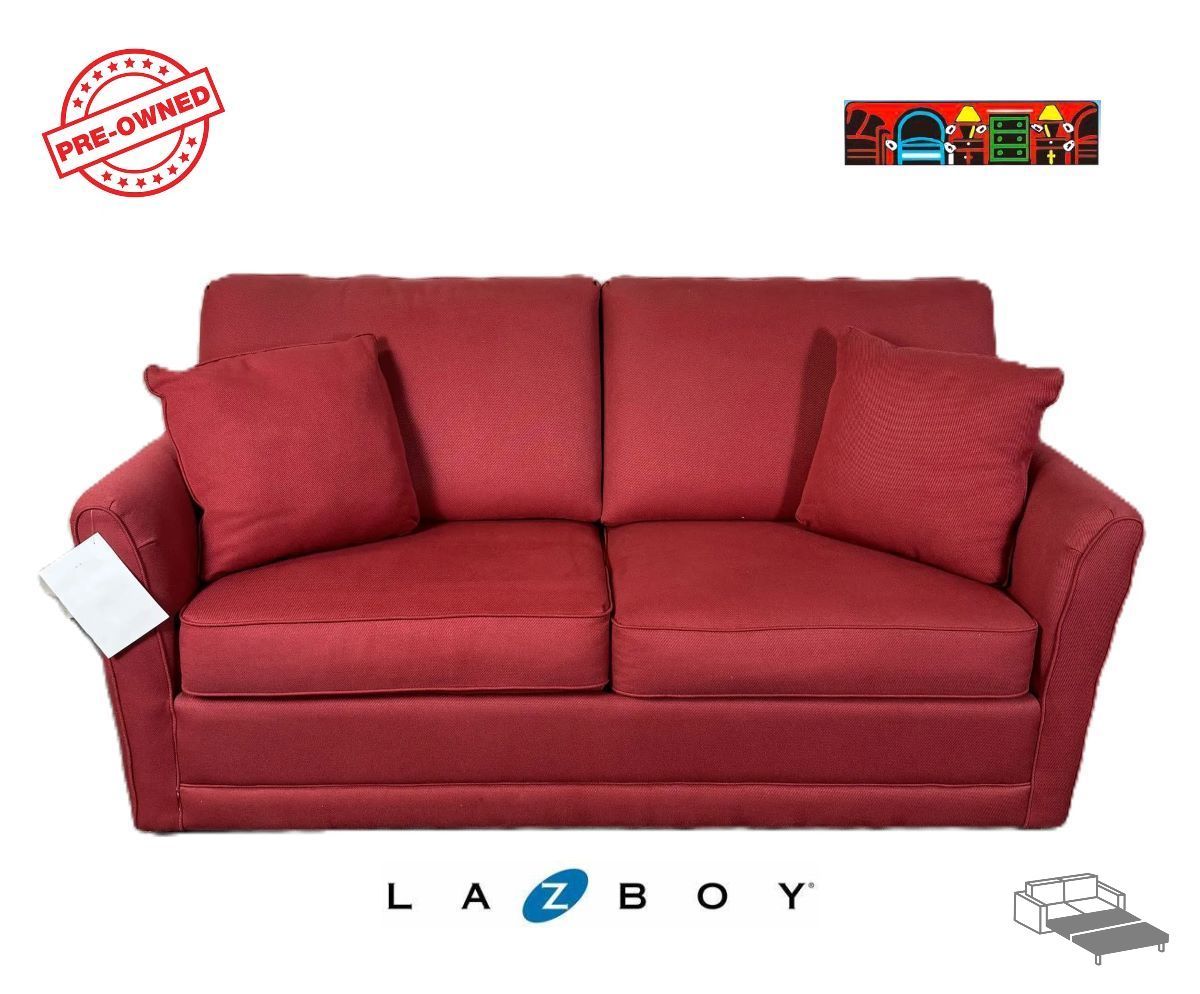 A  pre-owned full-size sleeper sofa upholstered in red fabric and adorned with matching red throw pillows.