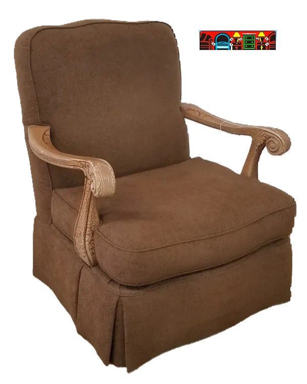 used Thomasville brown hi-back club chair with crackle finish arms & has a skirt chair.