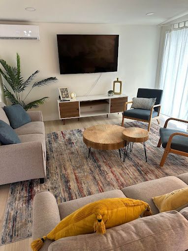 A living room filled with furniture and a flat screen tv.