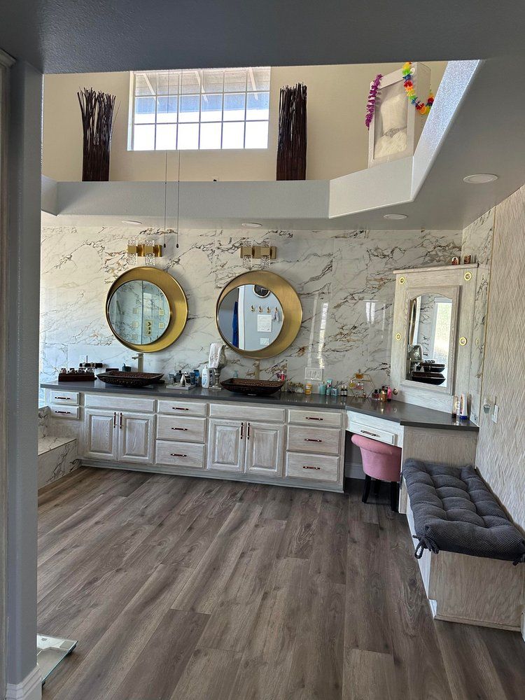A bathroom with two sinks and two mirrors.