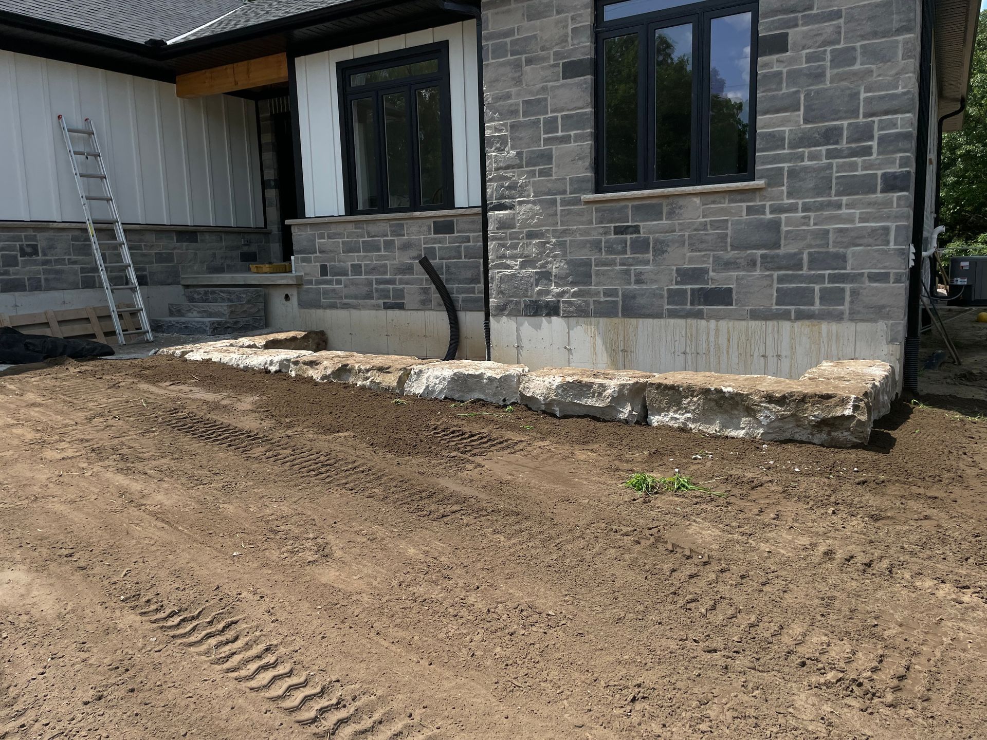 Completed backfill and levelling with excavator for new house construction.