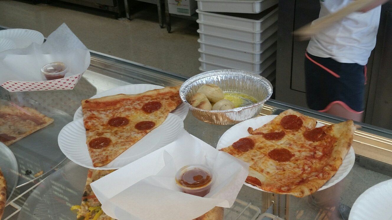 slices of pizza and garlic knots served up
