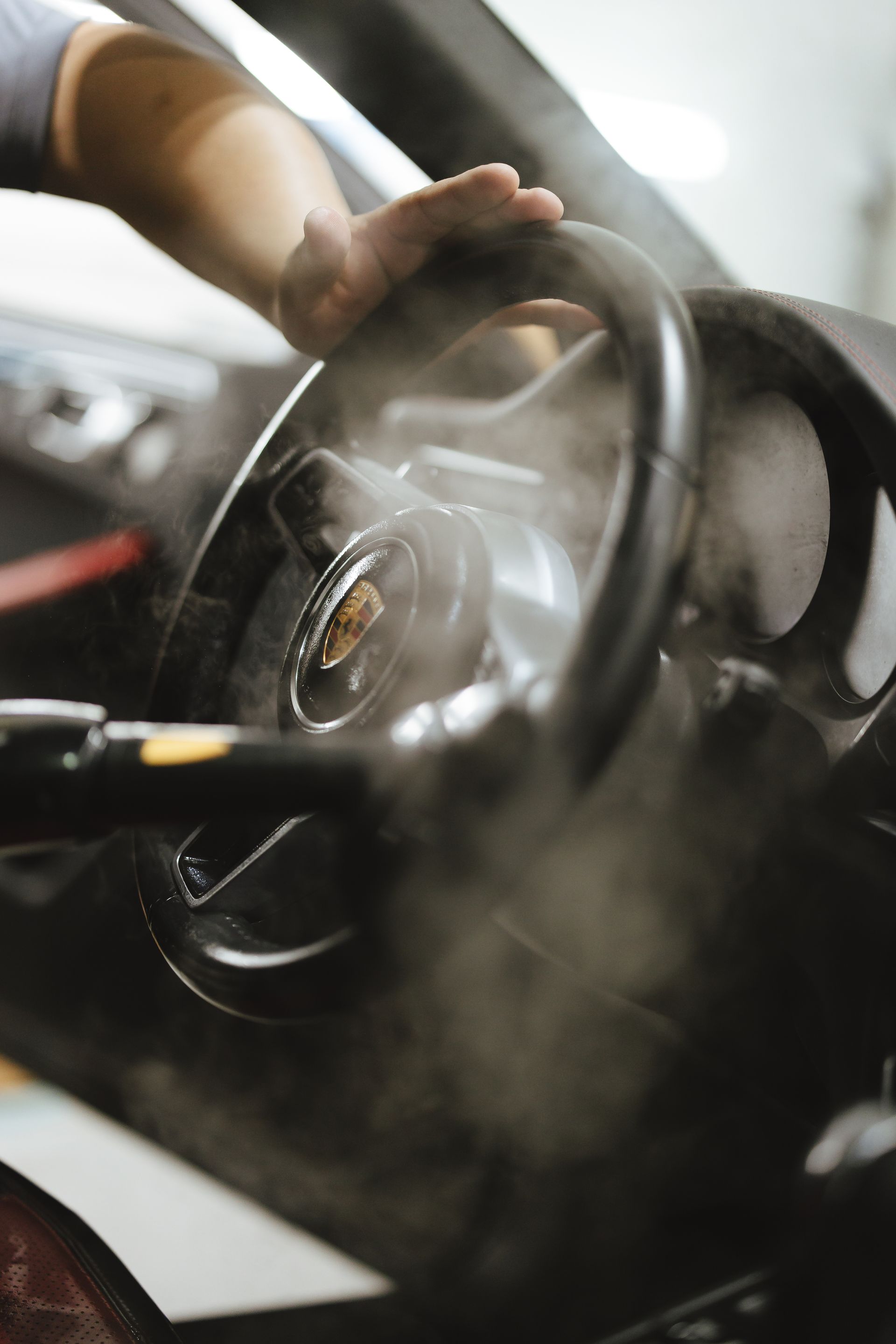 The interior of a mercedes benz car with a steering wheel and dashboard.