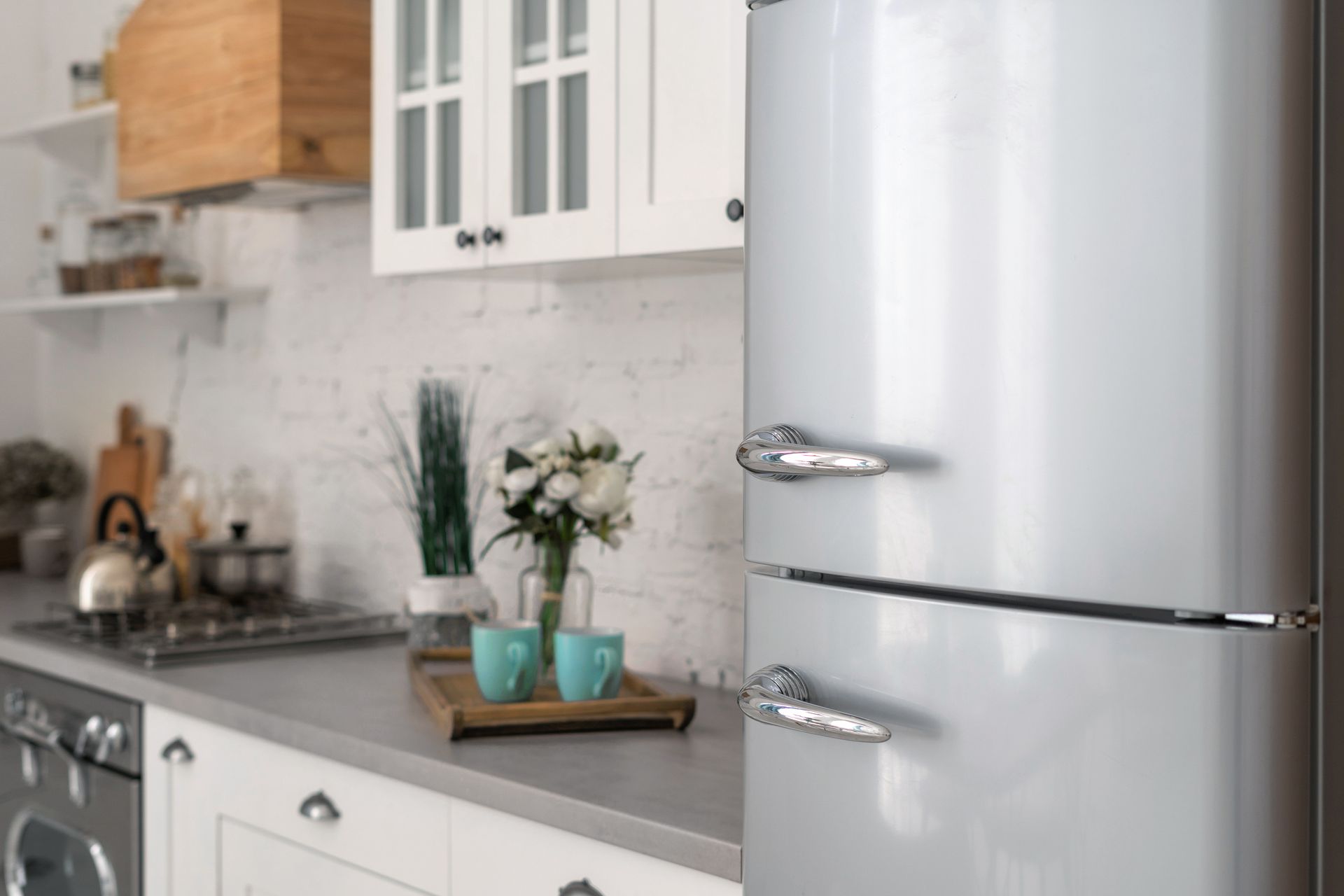 Silver refrigerator in a bright kitchen — Timberville, VA — Matt’s Appliance Service Inc