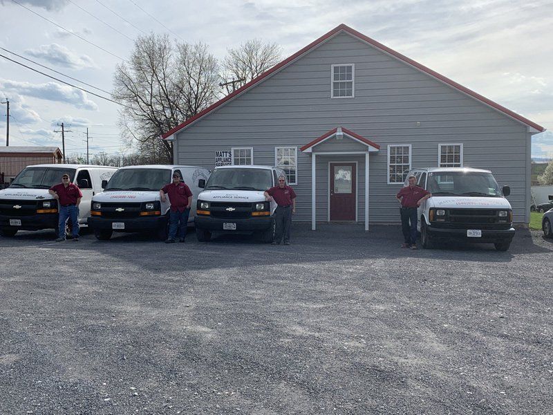 Workers Outside Beside Vans — Timberville, VA — Matt’s Appliance Service Inc