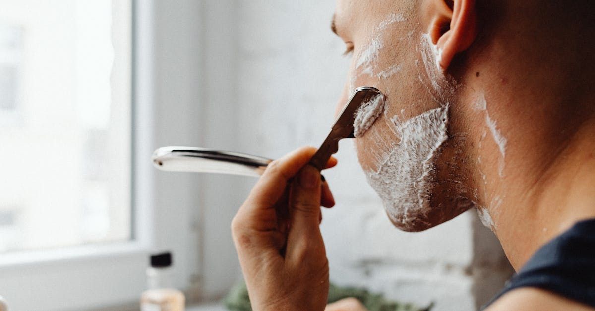 Man shaving face