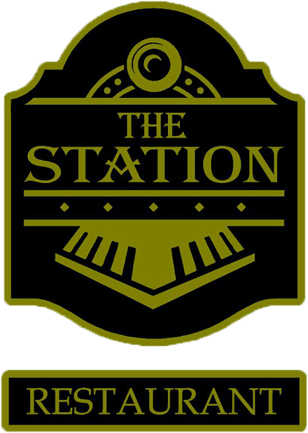 a black and gold sign for the station restaurant