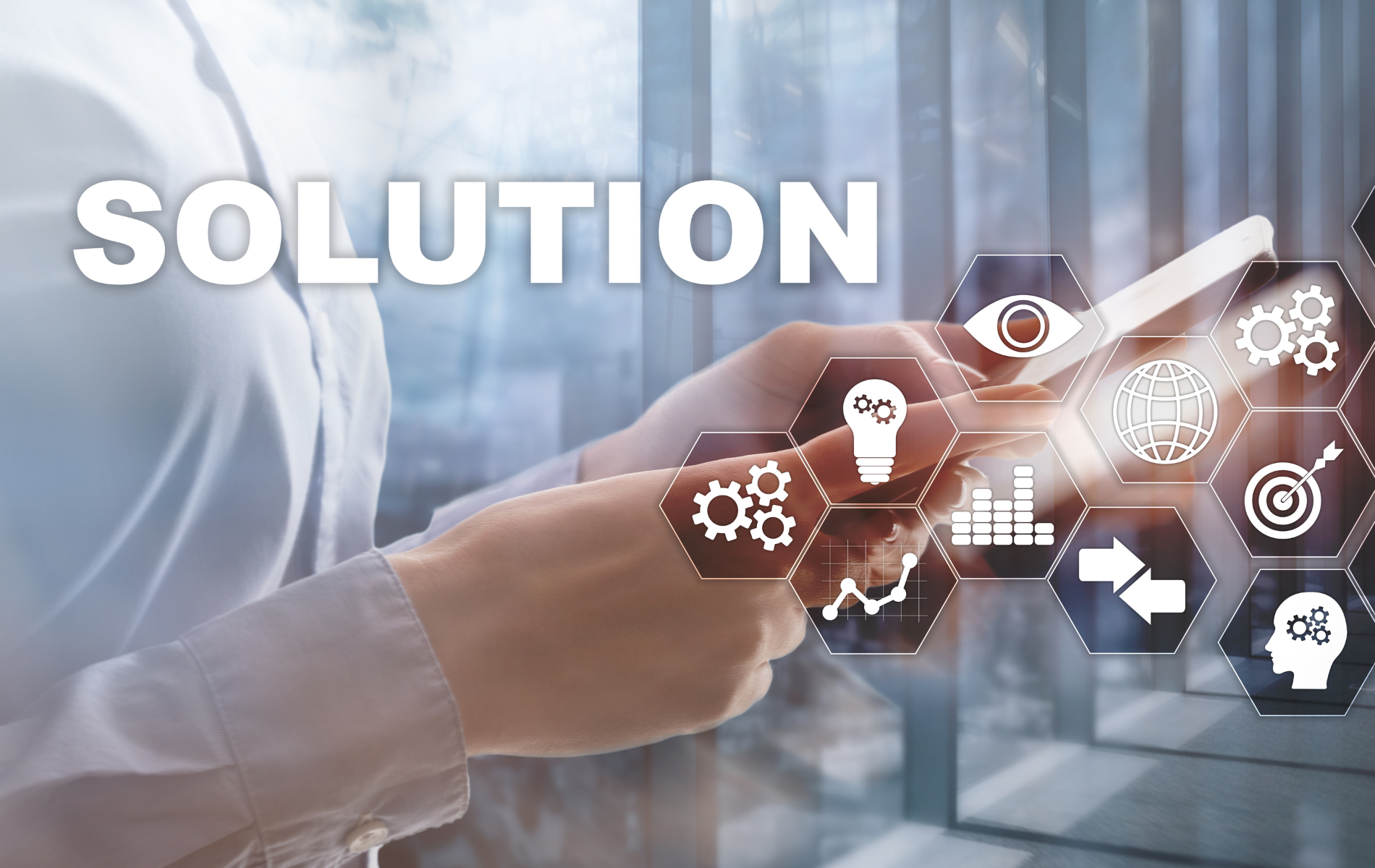 A person is using a tablet with a solution icon on it.