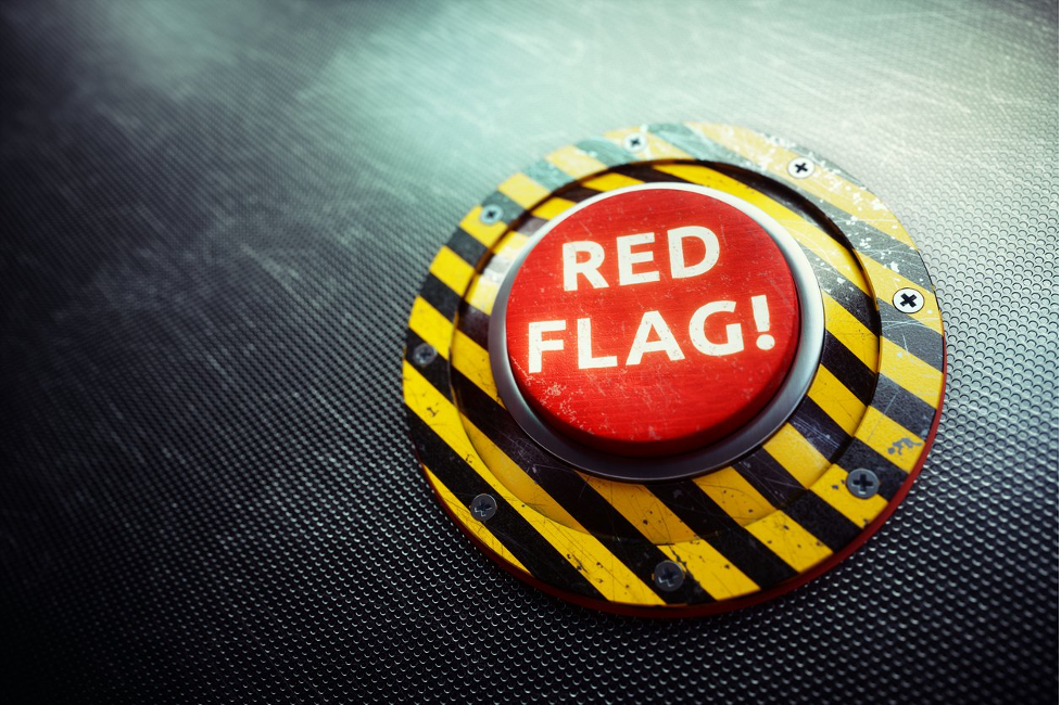 a red and black button that says red flag.