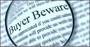 a close up of a magnifying glass with the words buyer beware