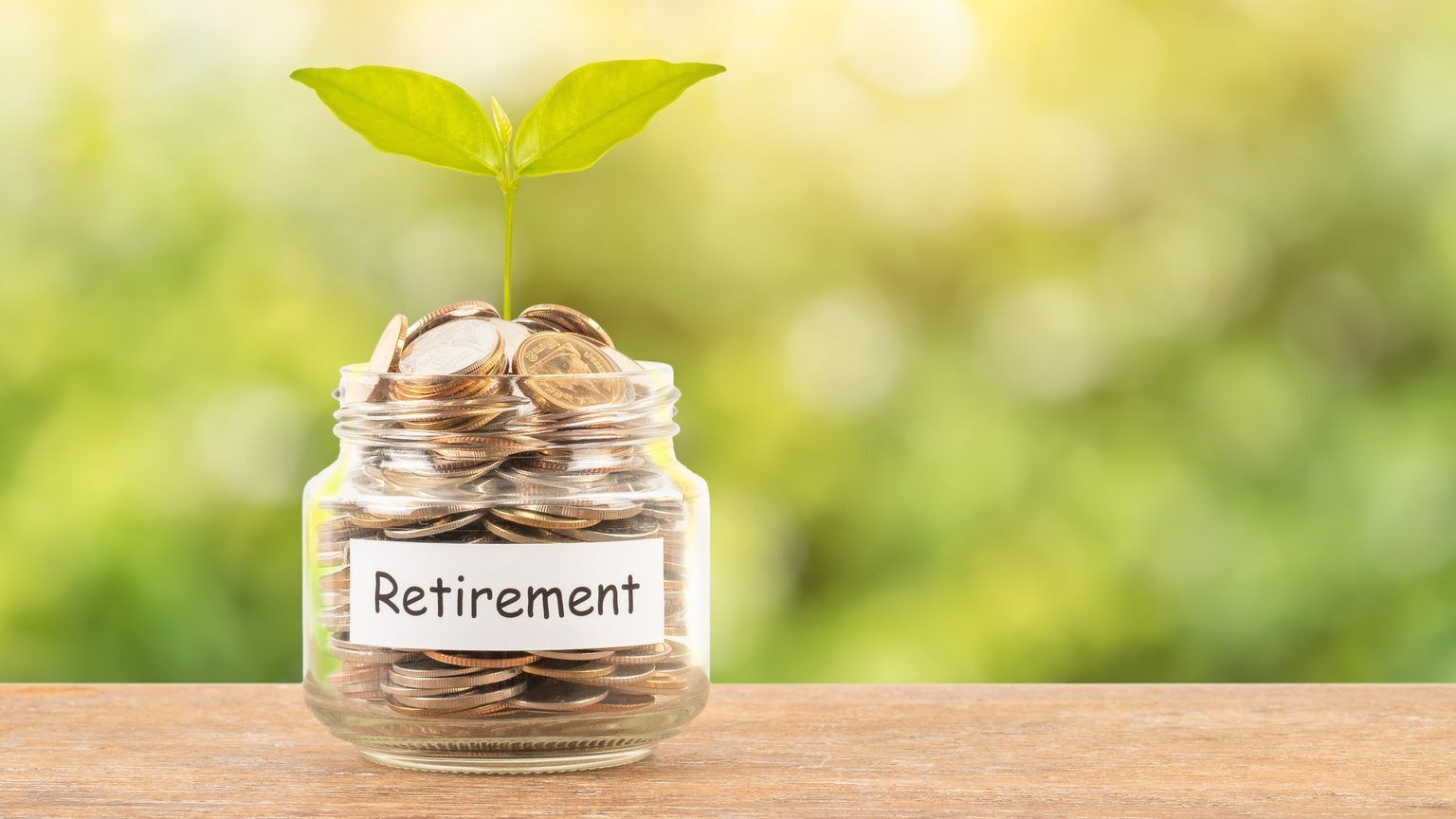 Jar filled with coins for retirement savings