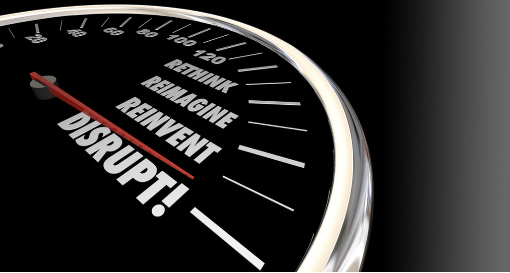 a close up of a speedometer with words rethink, reimagine, reinvent and disrupt on it