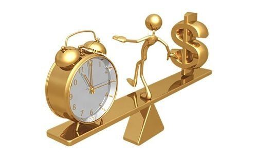 a gold clock and a gold dollar sign  sitting on top of a see-saw with a human trying to balance the weight.