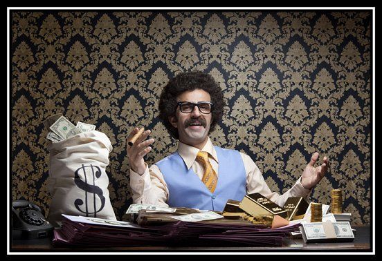 a financial advisor sitting at a desk with a bag of money