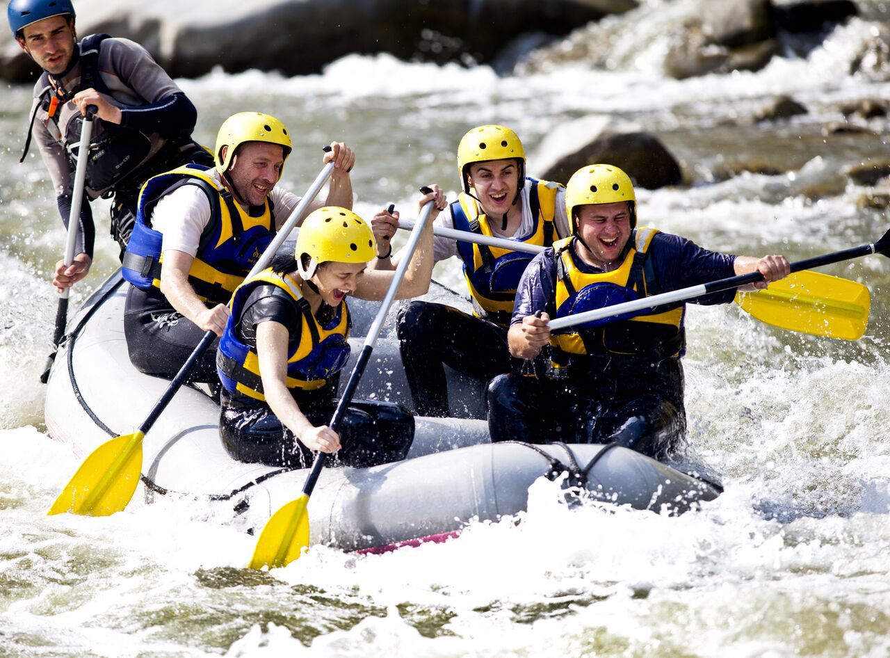 Group of Five People White Water Rafting  Living the Ideal Life