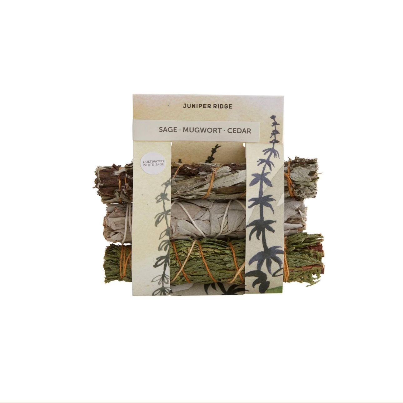 Bundled sage smudges: white, cedar, and juniper with a decorative card.