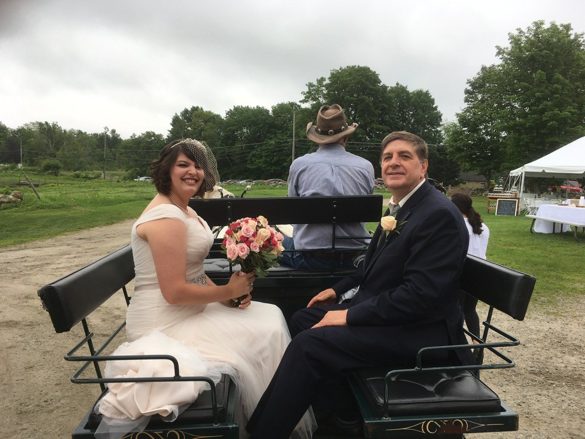 Eager bride ready for her horse carrige ride to her middle of the field ceremony at Bunnell Farm