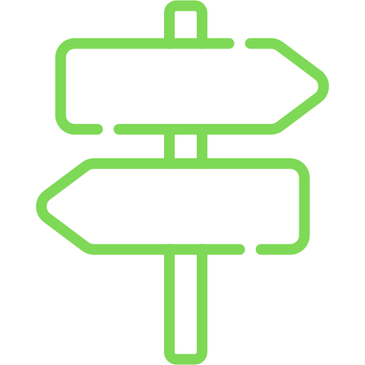 Un cartello verde con due frecce che puntano in direzioni opposte.