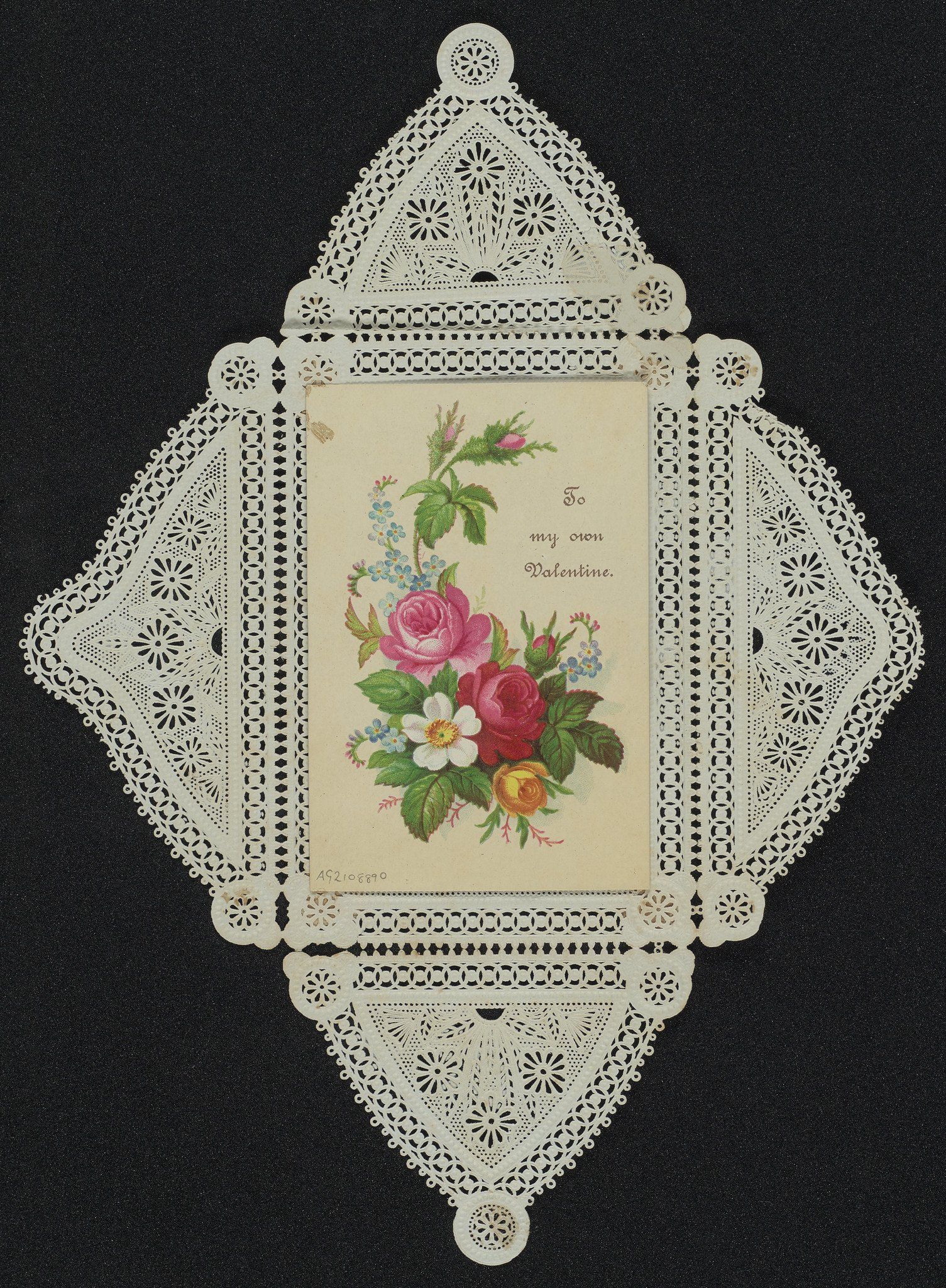 Single-sided Valentine card with printed floral design and the words 'To my own Valentine'; housed in the original lace paper envelope