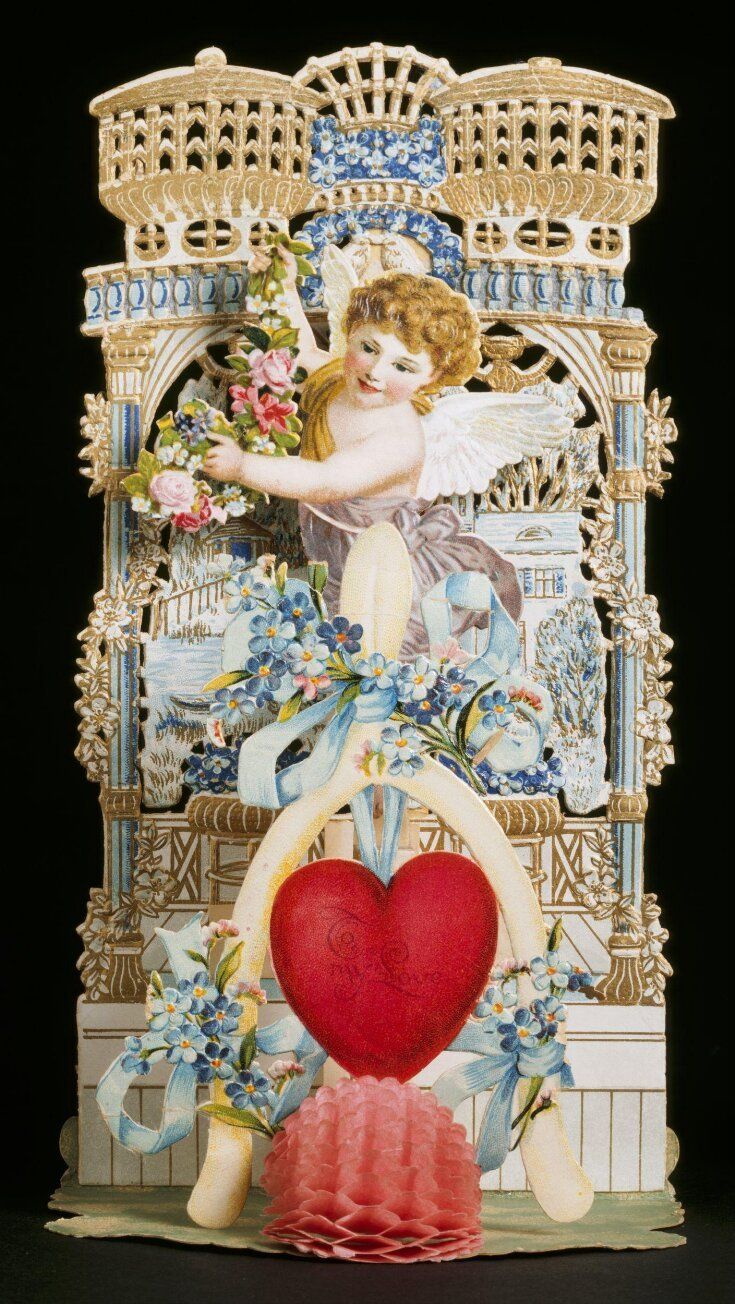A 3D image of a cupid figure holding a garland of flowers with a red heart in front; background is an ornate gold punched gate with pillars..