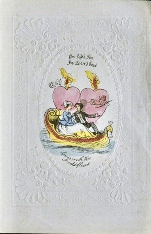 A white embossed card with a watercolour image in the centre of a man and woman in a boat, with two pink hearts behind them. The caption reads 'On life's sea, in love's boat, ever with thee, I could float'