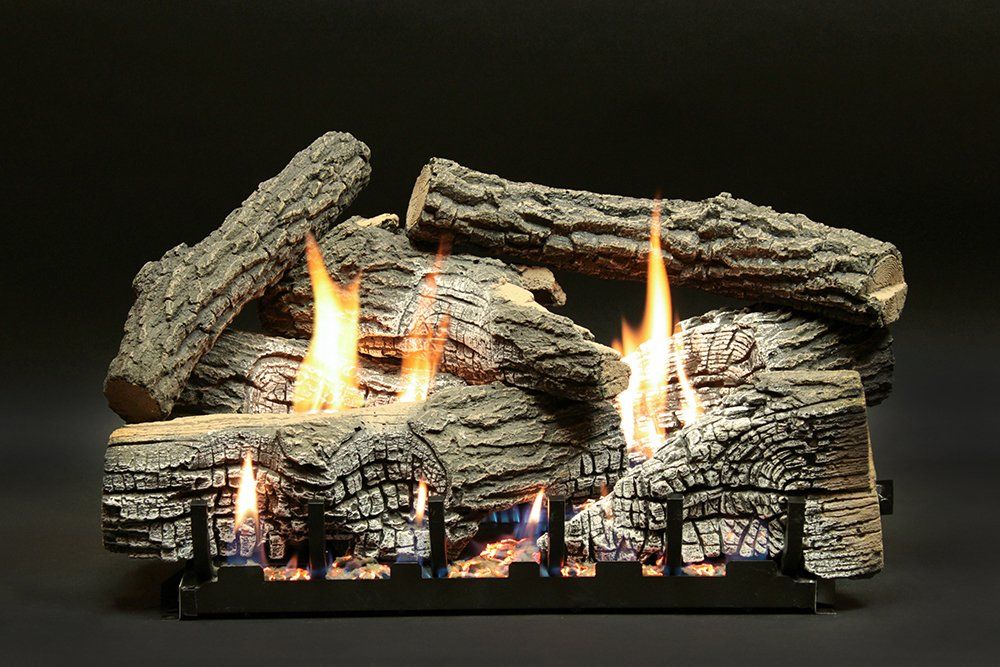 A fireplace made of logs with flames coming out of it