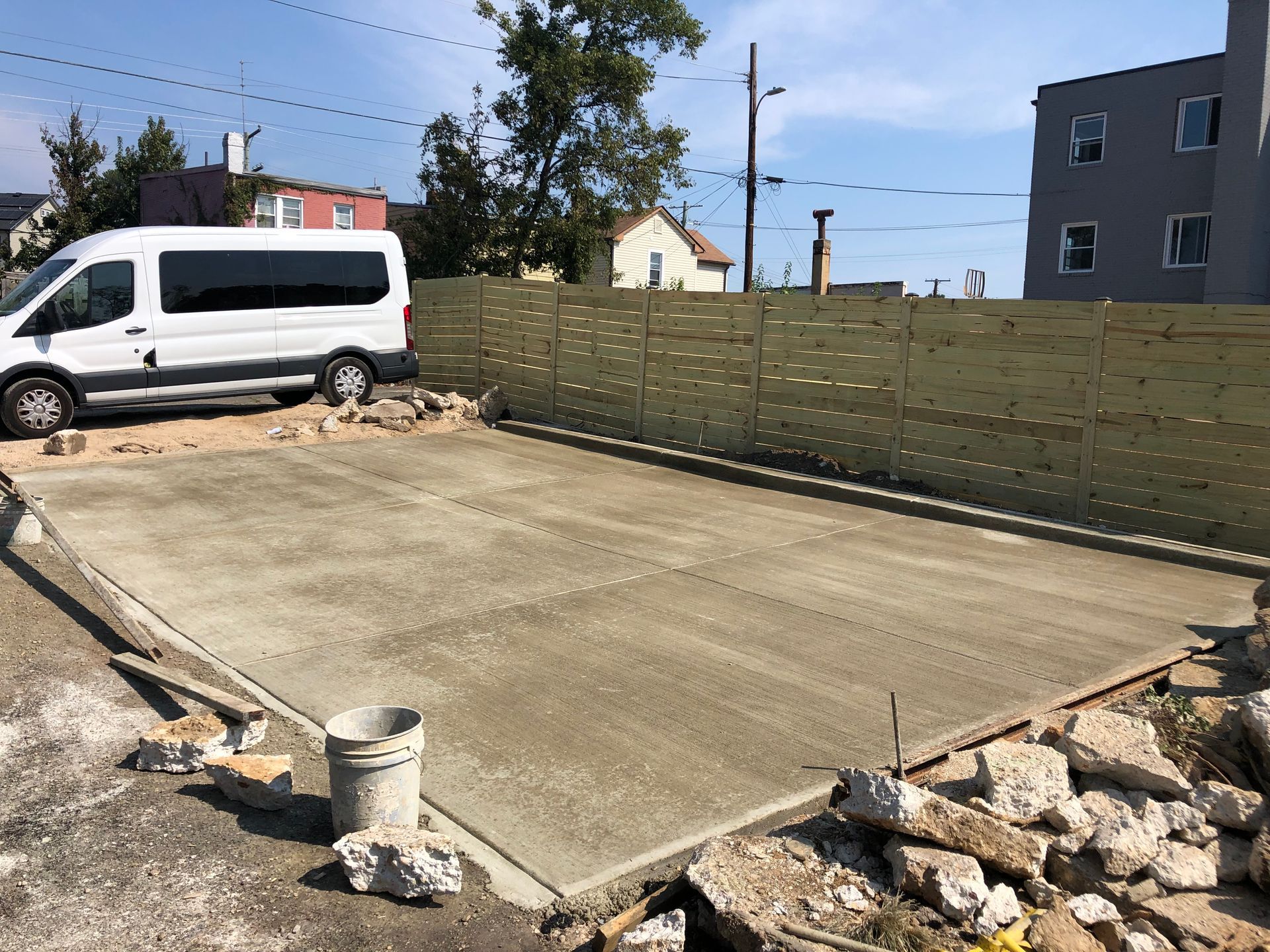 A concrete foundation is being built in a residential area.
