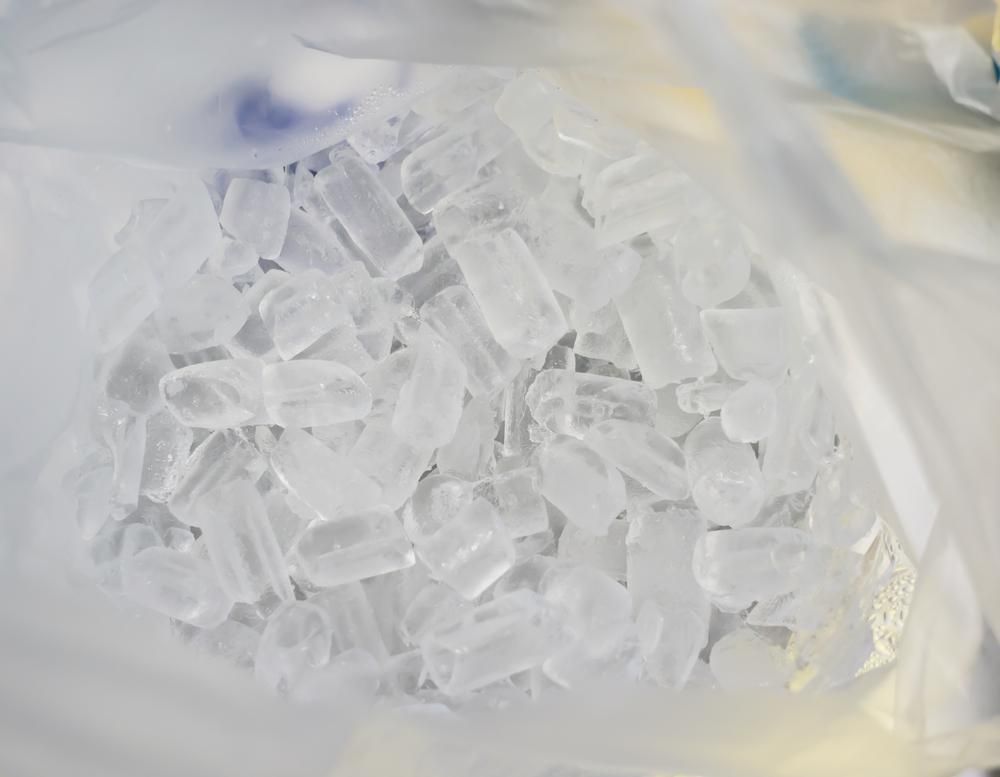 A Bag Filled with Ice Cubes Is Sitting on A Table — Cool Blue Ice & Water in Forbes, NSW